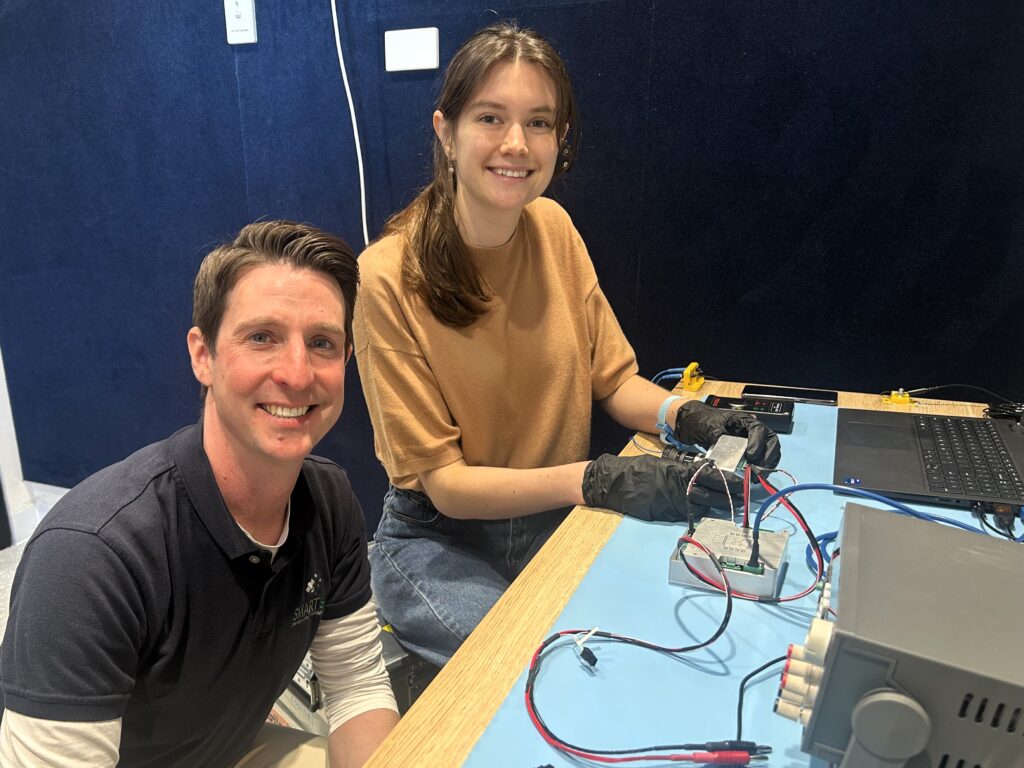 Satellite Systems Engineer Nick Manser and University of Adelaide researcher Sofia McLeod pictured in the Scarlet Lab.