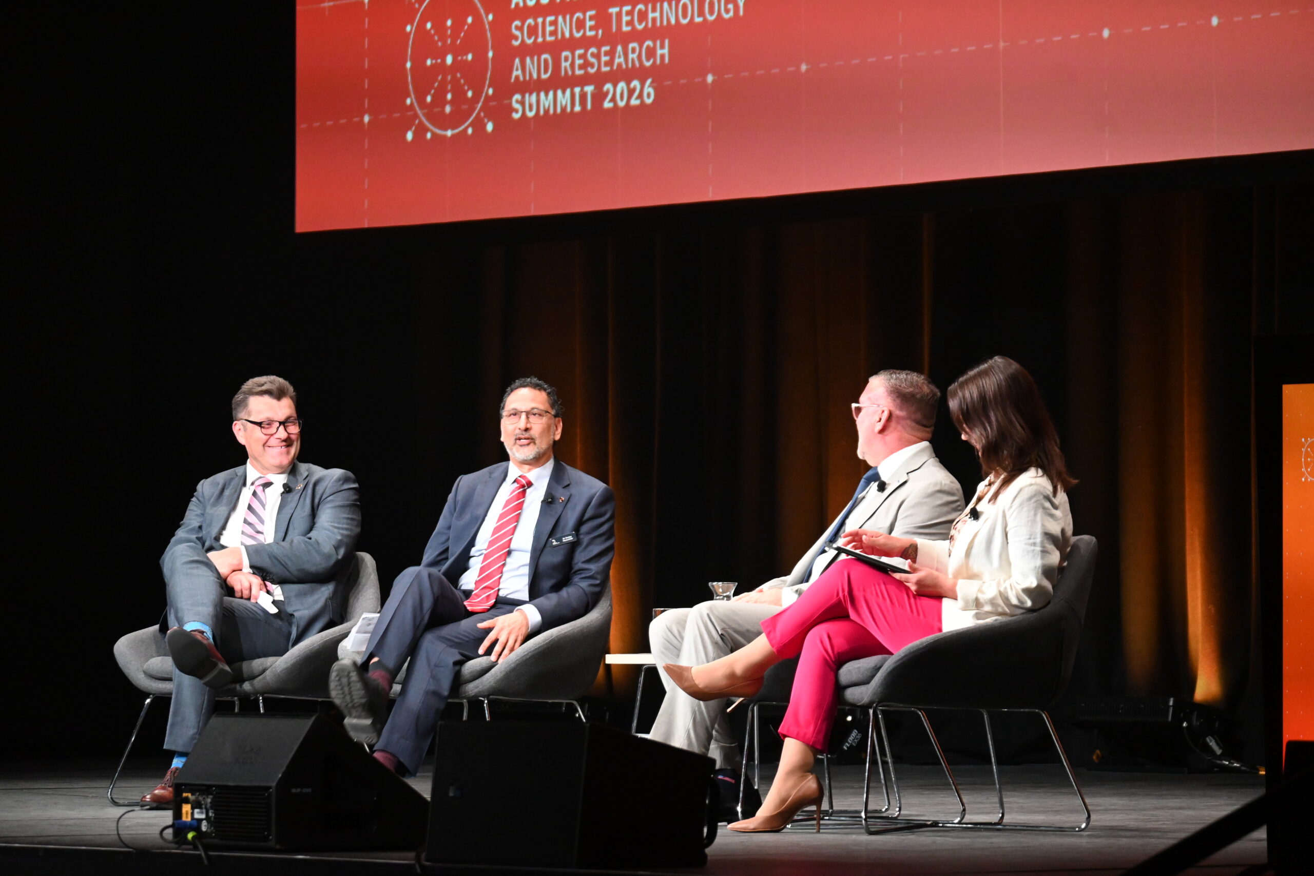 4 people on a panel talk